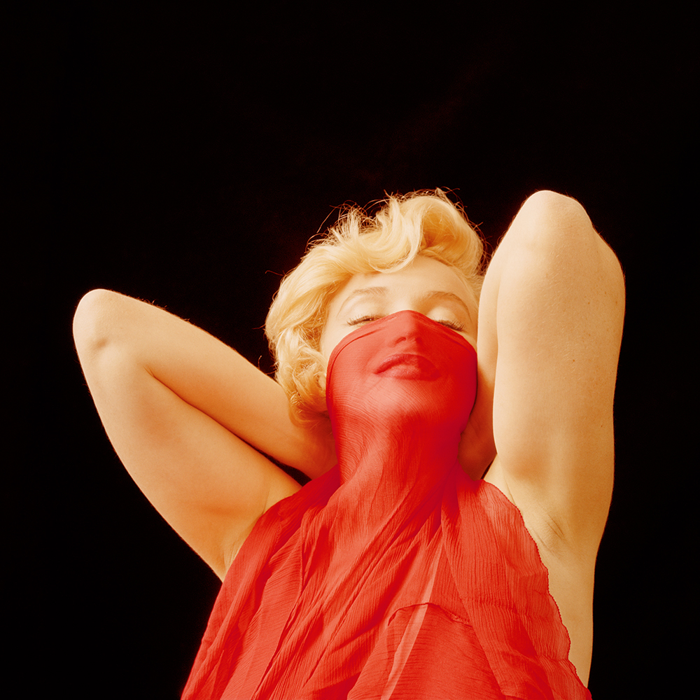 hbz-marilyn-playing-with-a-red-veil-ny-1957-milton-h-greene-archive-images